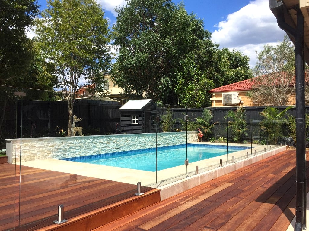 Frameless glass pool fencing around a Sydney backyard pool
