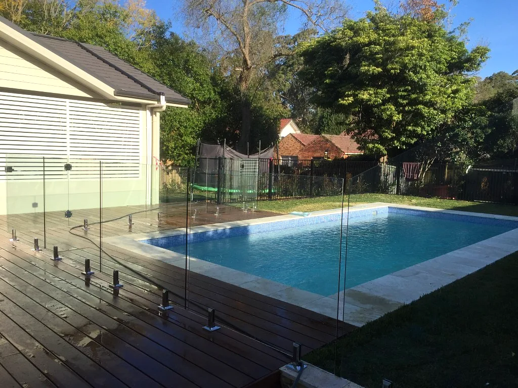Frameless glass pool fencing on a deck